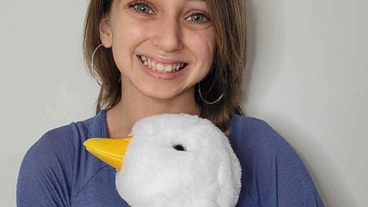 Photo of Shauna Rae holding an Aflac Duck.