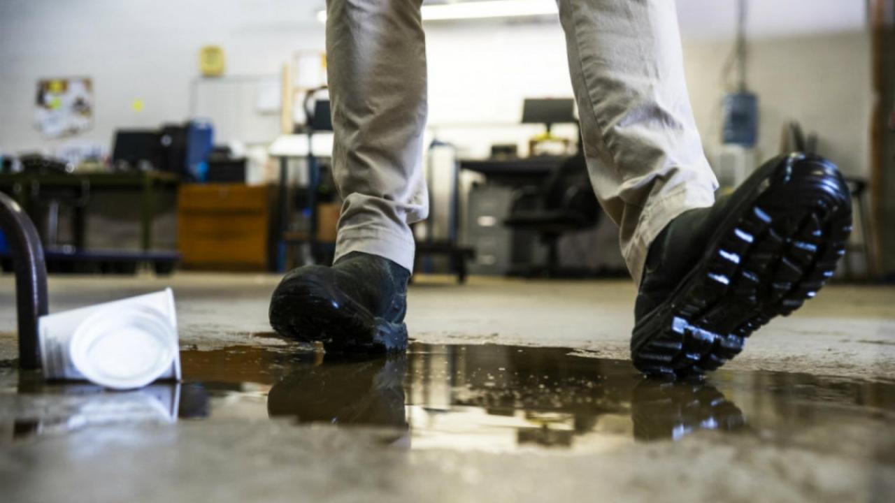 a person slipping on a wet floor
