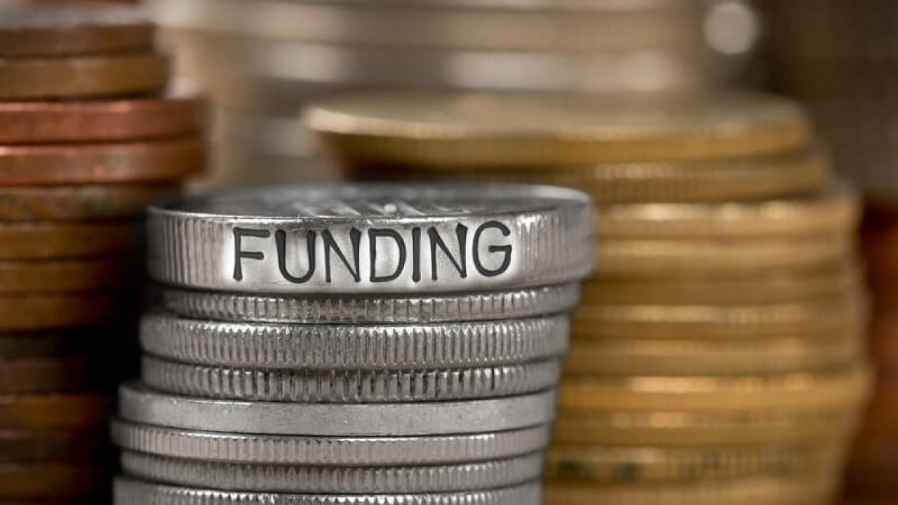 Funding image of stacks of coins.