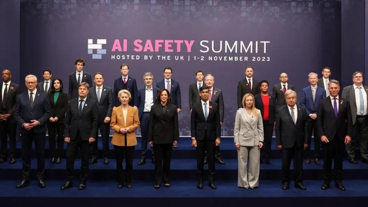 Group of people standing at the AI safety Summit