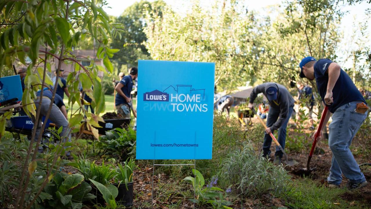 Photo of people working in a garden