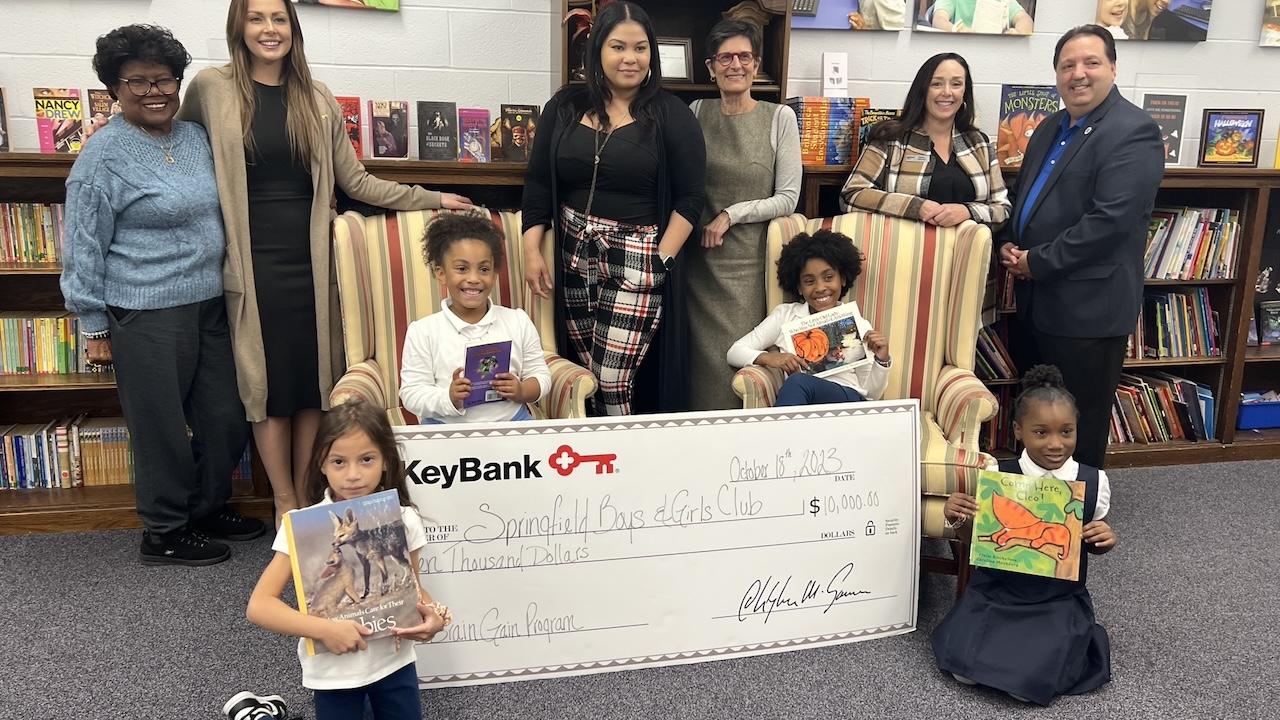 (from left) Springfield Boys & Girls Club board member Aleana Laster; KeyBank Corporate Responsibility Officer Analisha Michanczyk, Branch Manager Vanity Bryant; SBGC Director of Development Karen Natsios;  KeyBank Area Retail Leader Sarah Germini; and Springfield Boys & Girls Club Executive Director Vinnie Borello (far right), with students in the Brain Gain program.      