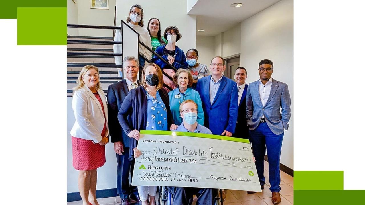 representatives of Regions Foundation and Starkloff Disability Institute pose with large check