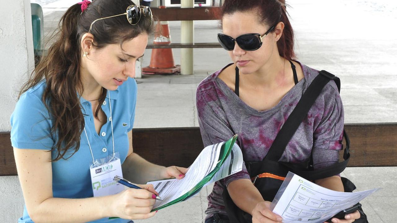 two people reviewing papers together