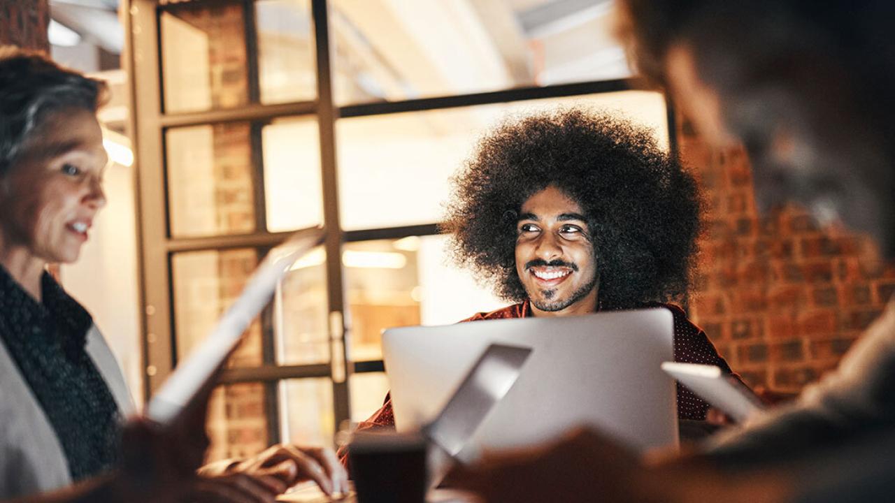 people smiling in a meeting