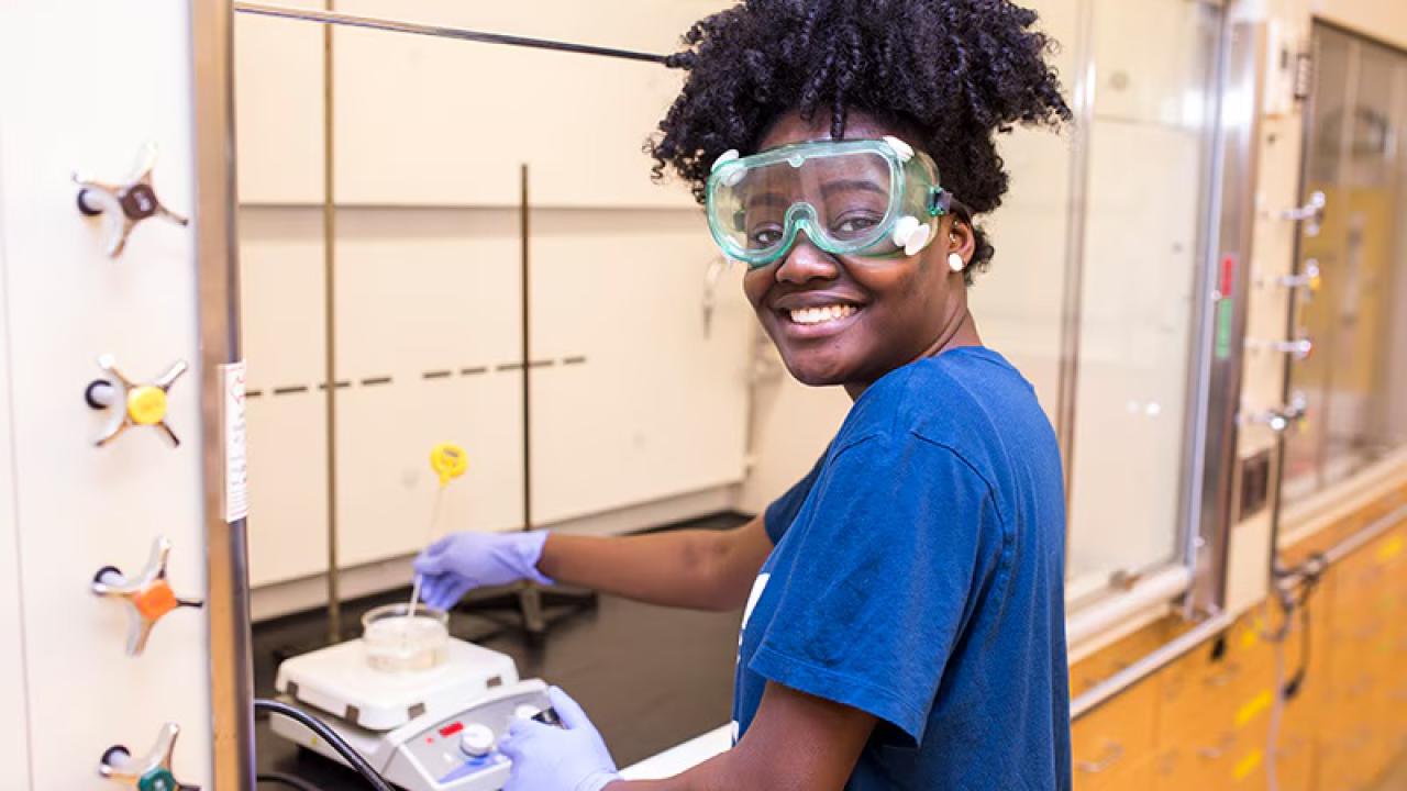 A student wearing safety goggles 