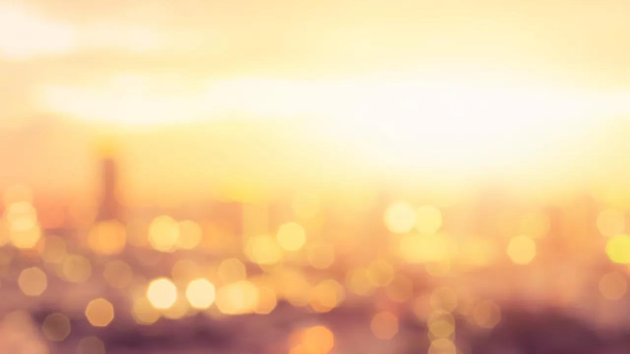 City glowing with golden sunlight.