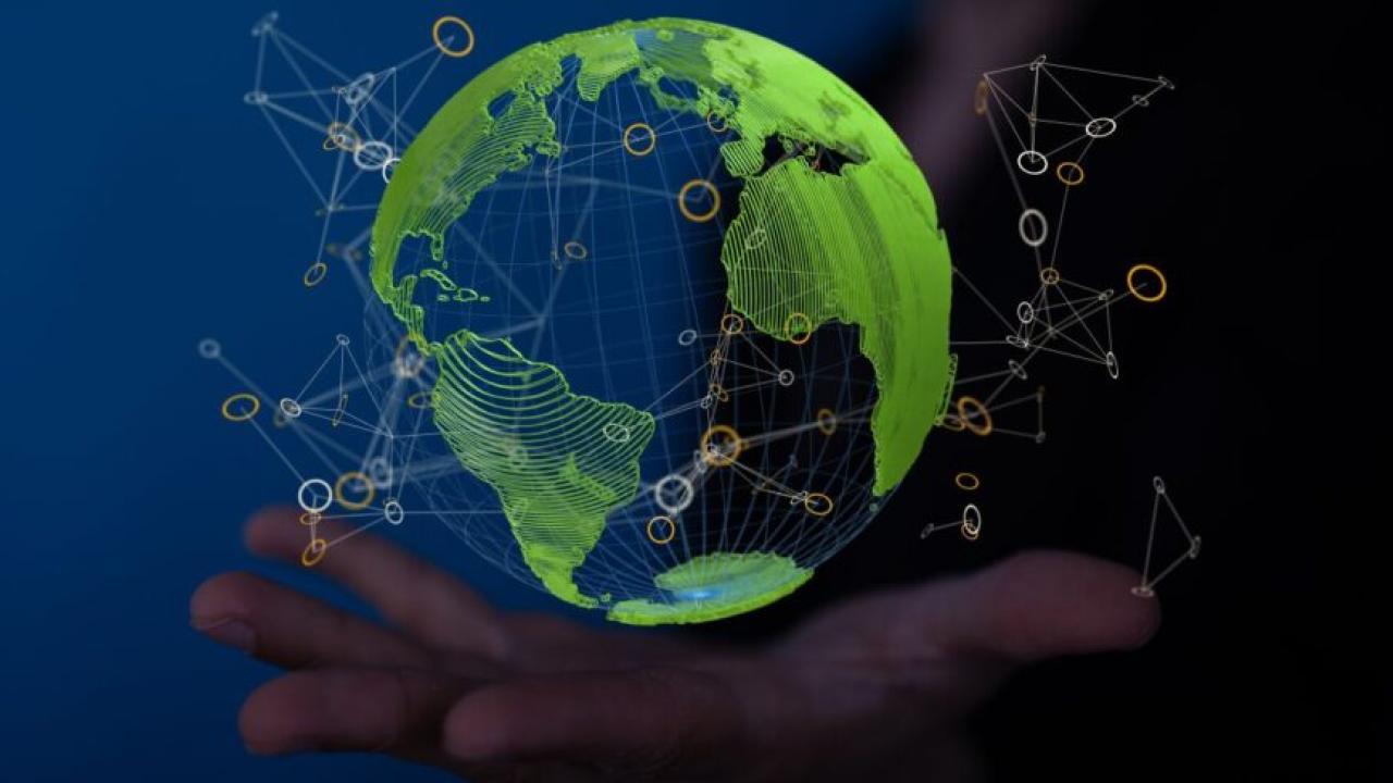 Globe shown in the palm of a hand.