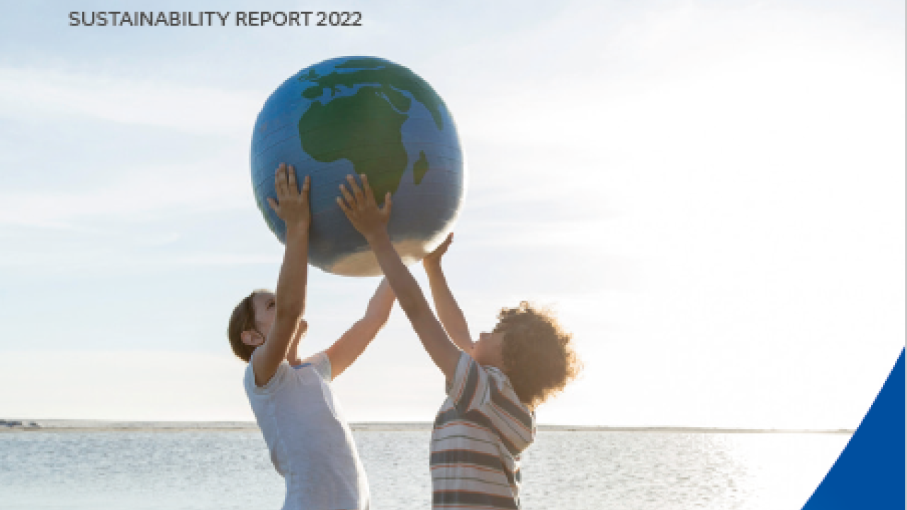 SABIC's 2022 Sustainability Report Cover, featuring a picture of two children holding a ball that looks like planet Earth