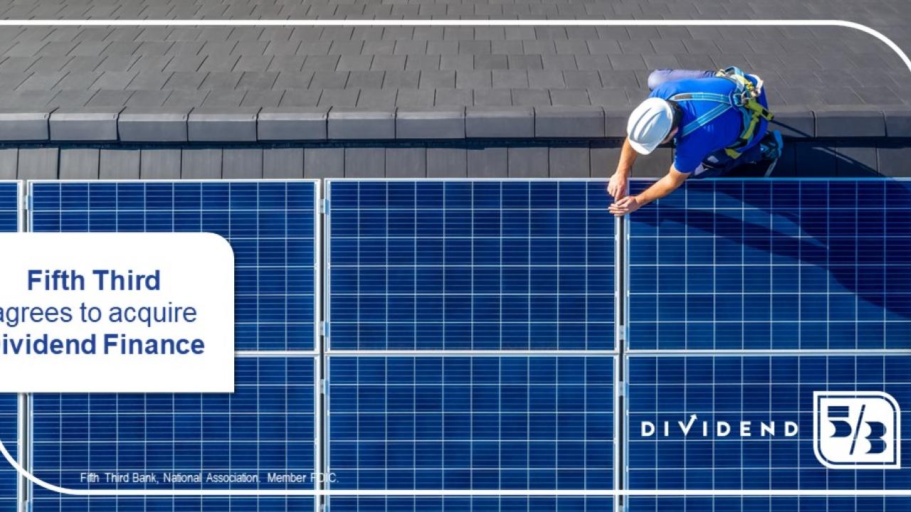 Man working on solar panels