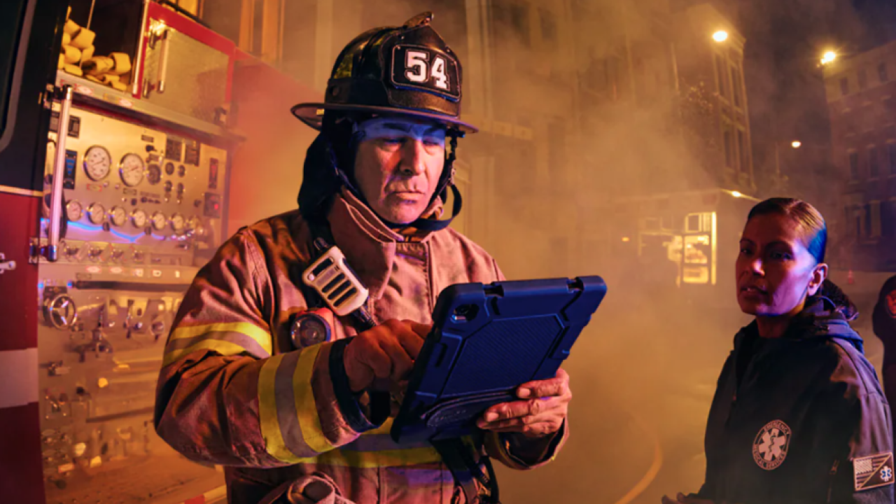 First responder holding a smart device 