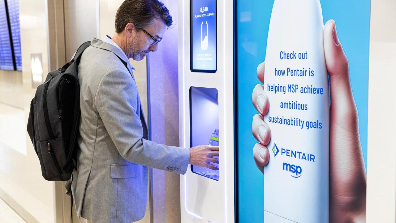 Man filling water bottle