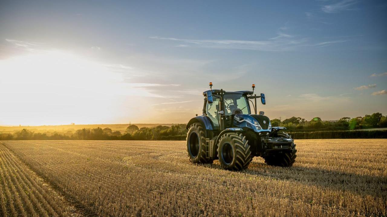 tractor on a field at dawn