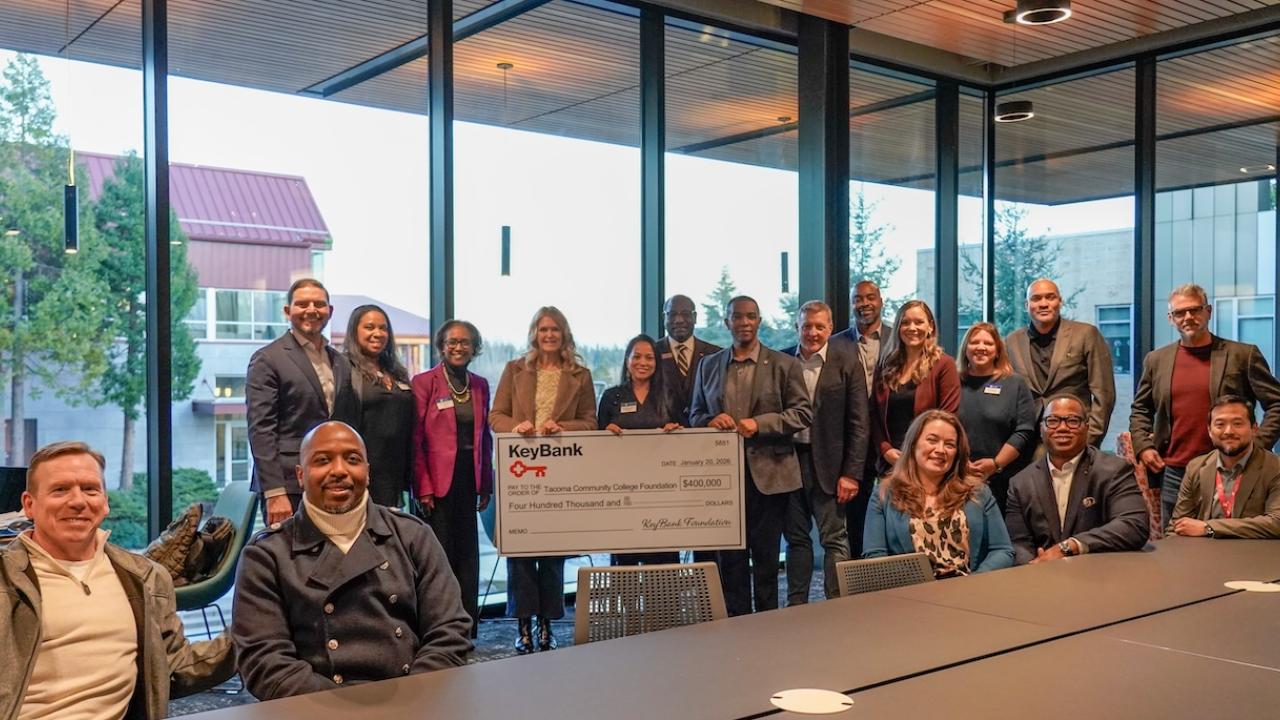 Representatives from Tacoma Community College and KeyBank shown with a $400,000 grant check.