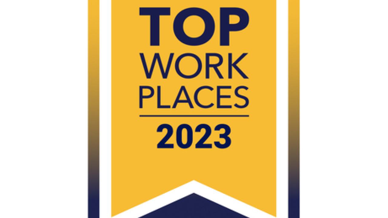 Gold and blue badge "Top Work Places 2023 USA"