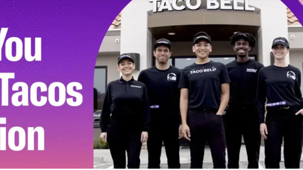 Group of employees standing outside a Taco Bell