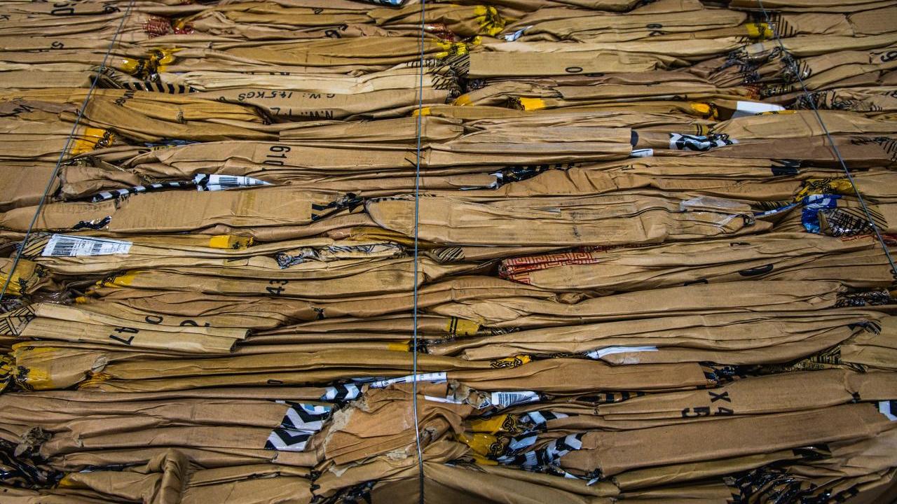 Flattened cardboard boxes at Coach's (Re)Loved and Repair workshop