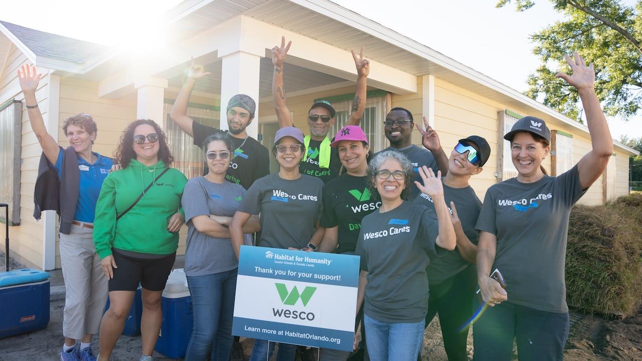 Team Wesco shown in front of the house that they worked on during the ream build.