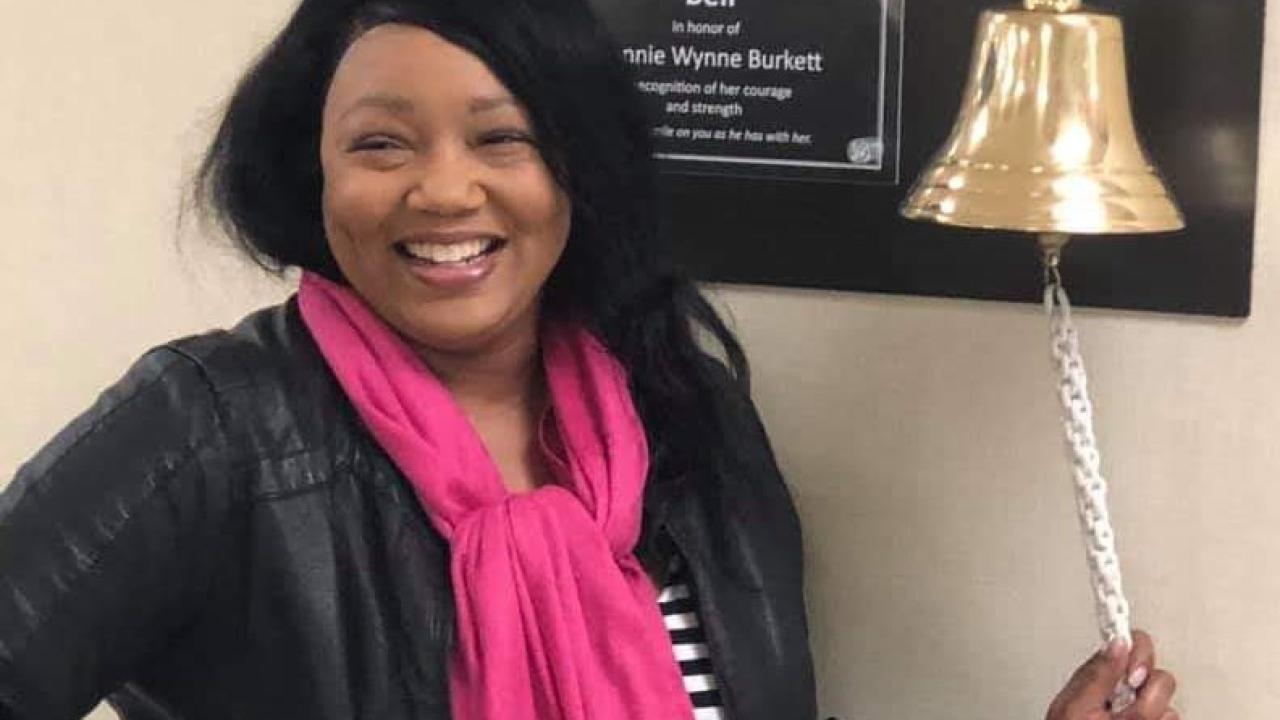 Teosha Harrison ringing the I beat cancer bell. 