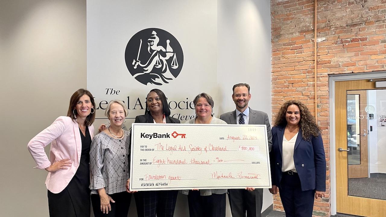 KeyBank Cleveland team members present an $800,000 check to Legal Aid Society Cleveland.