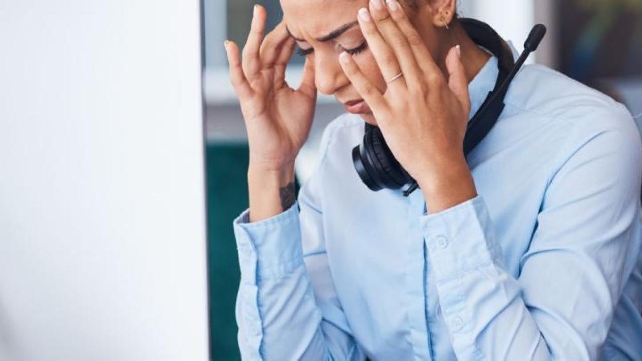 Stressed office worker in front of computer