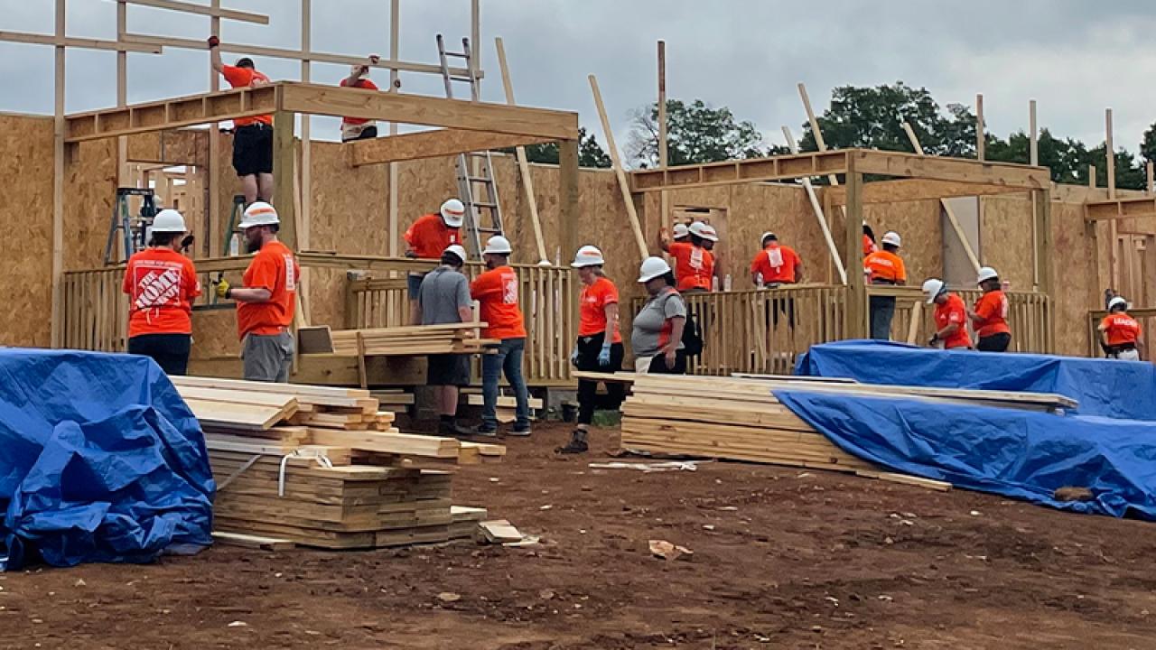 The Home Depot Foundation team members working on a building site.