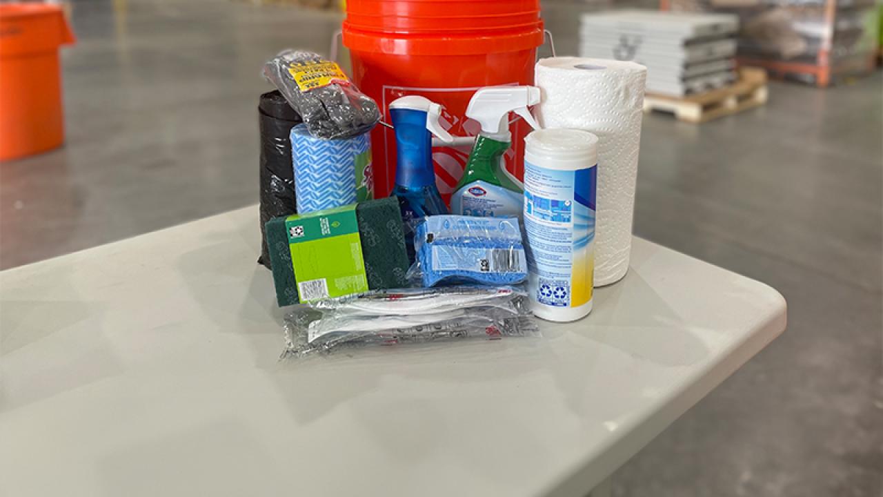 The Home Depot Disaster kit: bucket, trash bags, sanitizer and face mask.