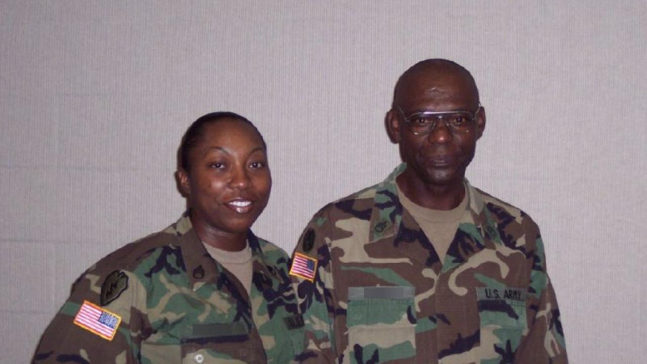Tinisha Roberts in military uniform next to another person.