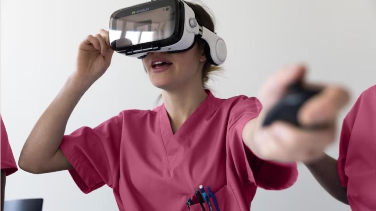 Female technician shown wearing virtual reality glasses and wearing scrubs.