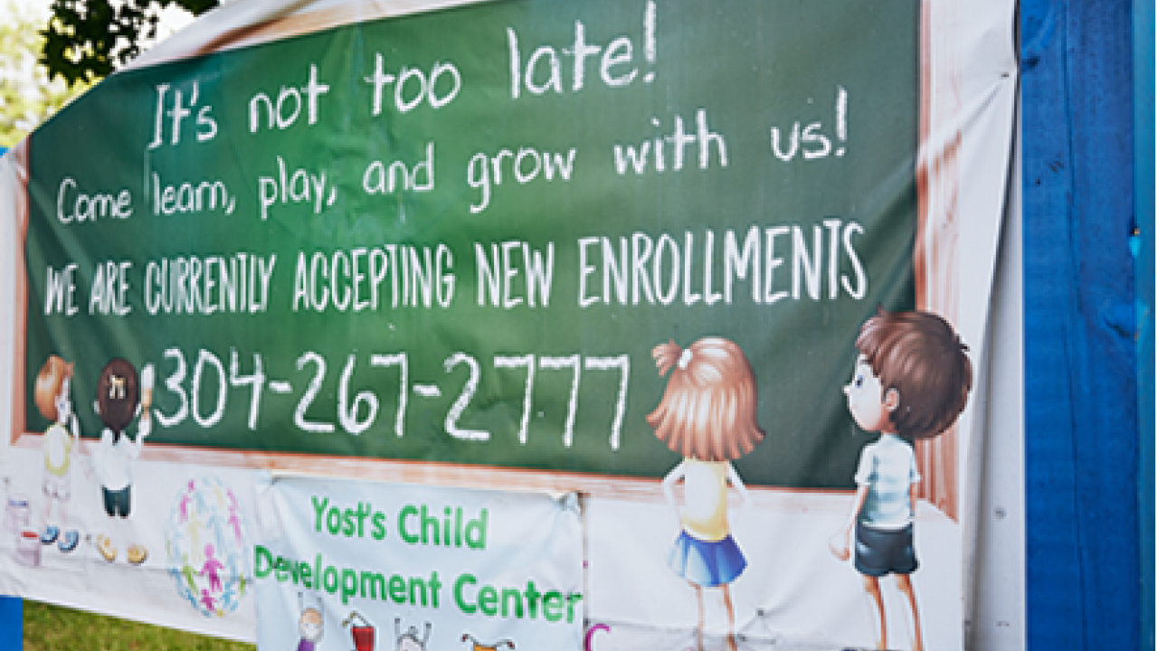 Sign reading 'It's not too late! Come learn play and Grow with us! We are currently accepting new enrollments'