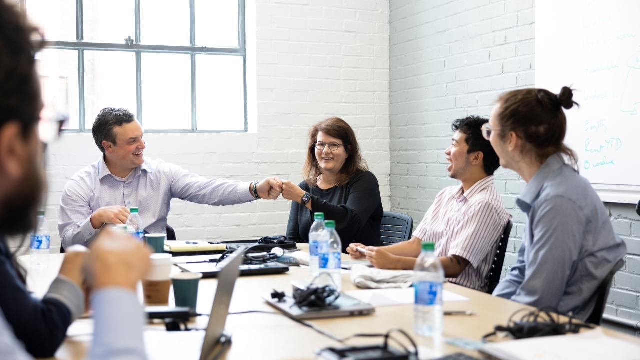 people sitting at conference table 