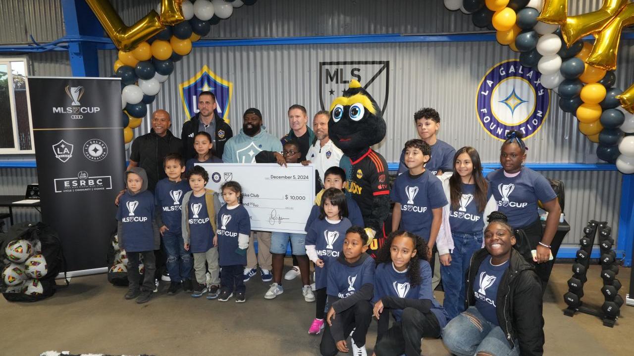 Jan Mirman, Senior Vice President, MLS Community Engagement, Tom Braun, President & COO, LA Galaxy, LA Galaxy alumni and MLS Greats Cobi Jones and Robbie Keane presented the East Side Riders Bike Club with a check donation.