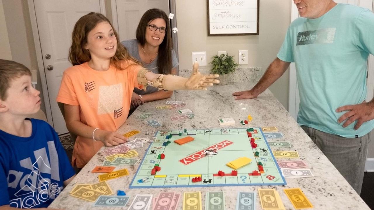 family playing monopoly 