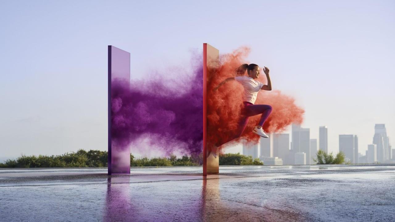 image of runner running through colors