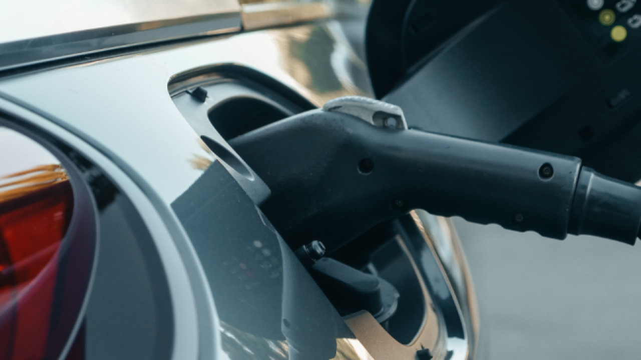 Electric vehicle being charged