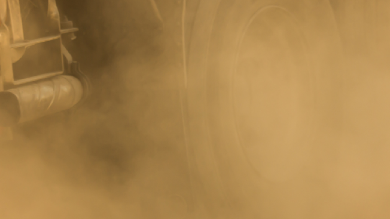 Vehicle moving through dust
