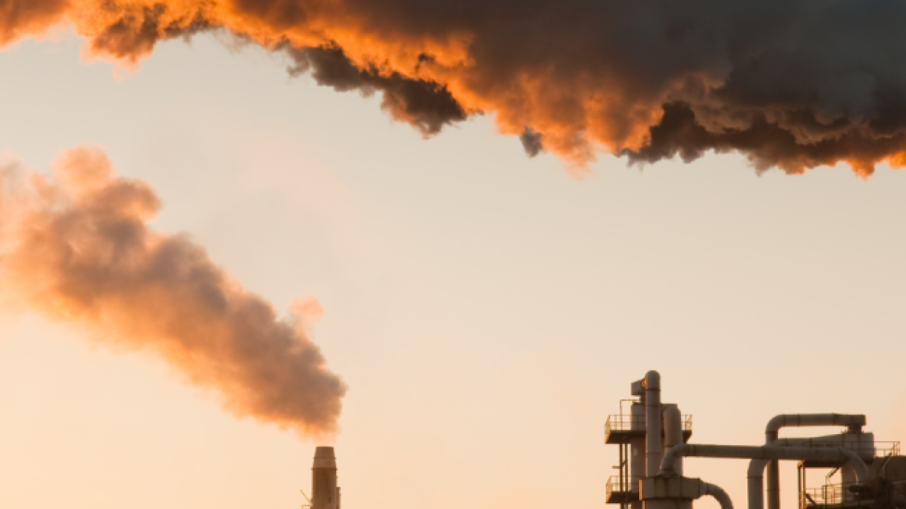 Smoke pumping out of an industrial complex