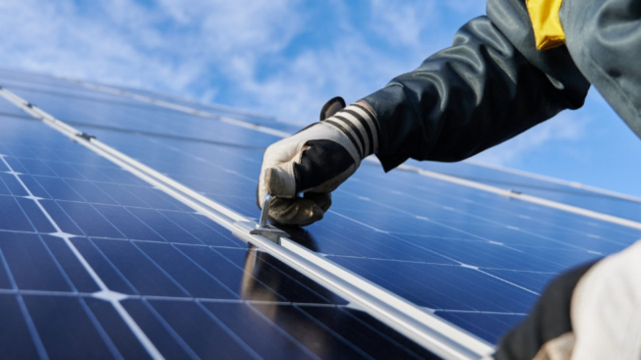 person installing solar panels