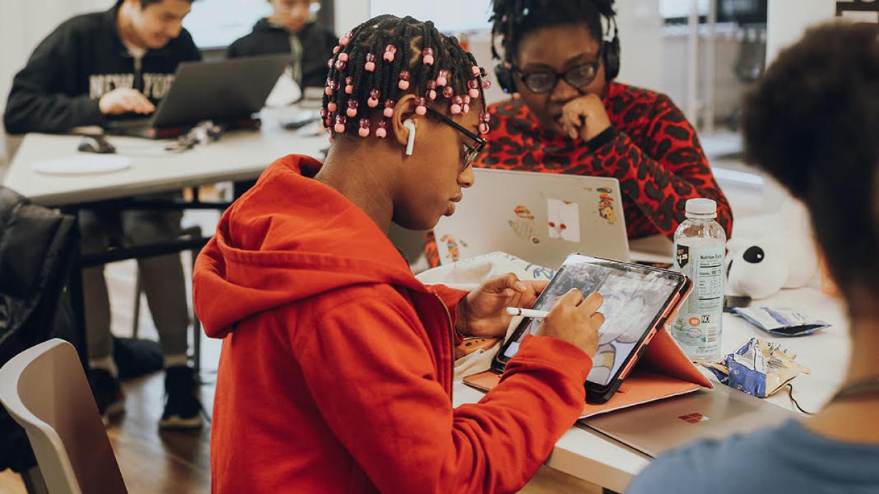Students learning game design at Urban Arts' Learning Lab in New York City.