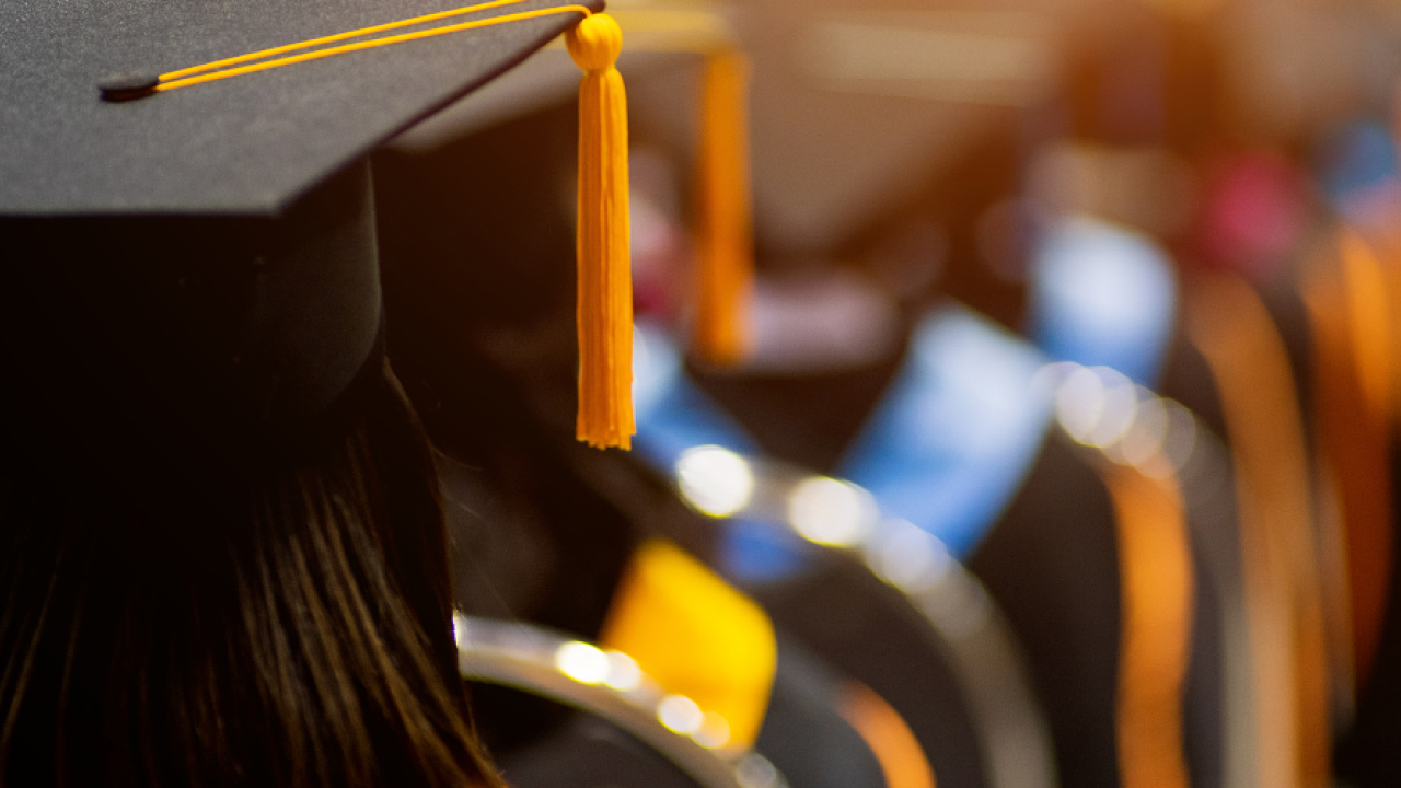 Wesco VOLT Scholarship program. Graduate shown in cap and gown.