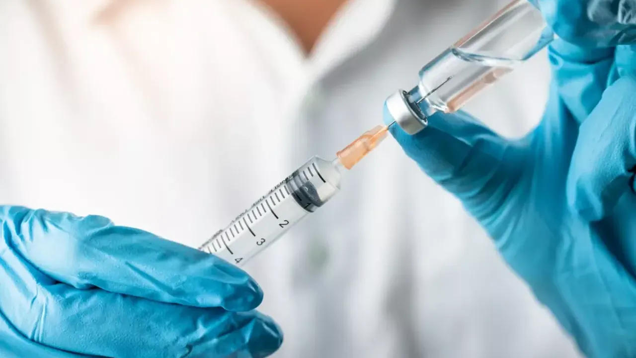 health professional preparing a vaccine 