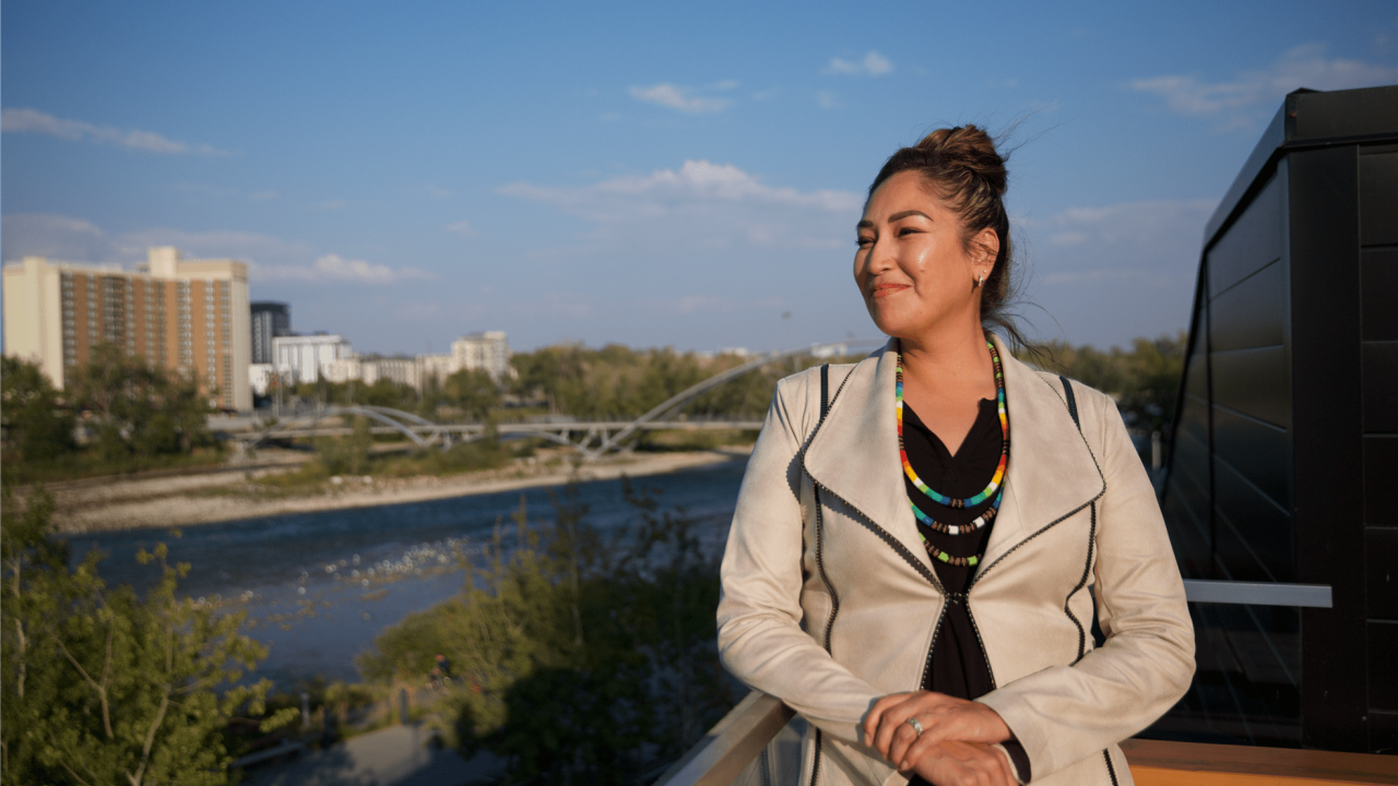 Veronica Big Plume outside overlooking a river