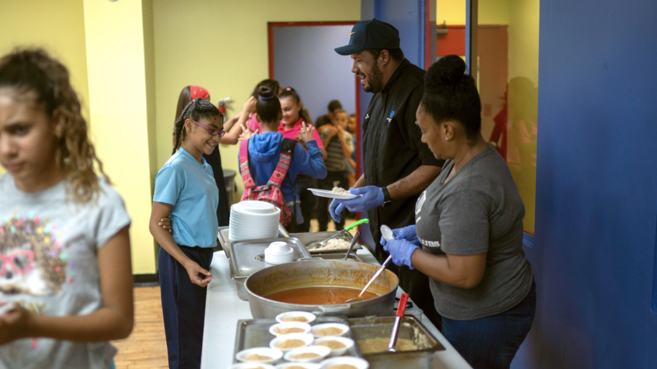 volunteers serving food