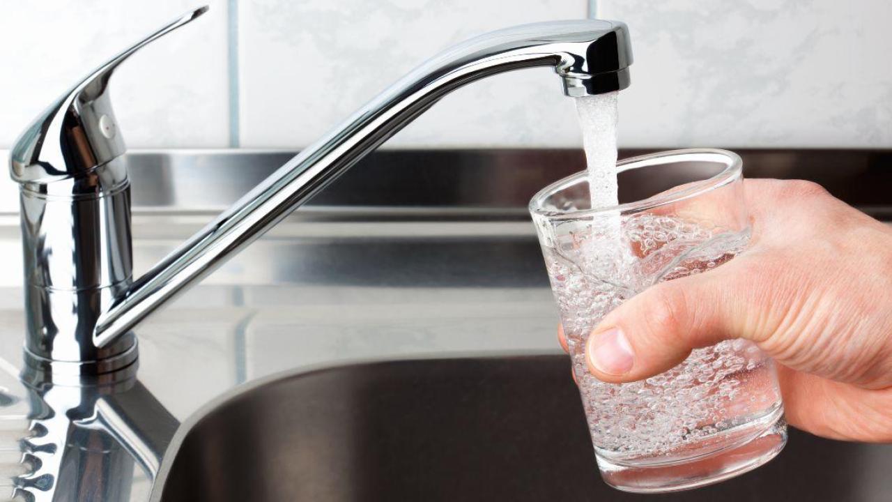 Getting a glass of water from the kitchen sink