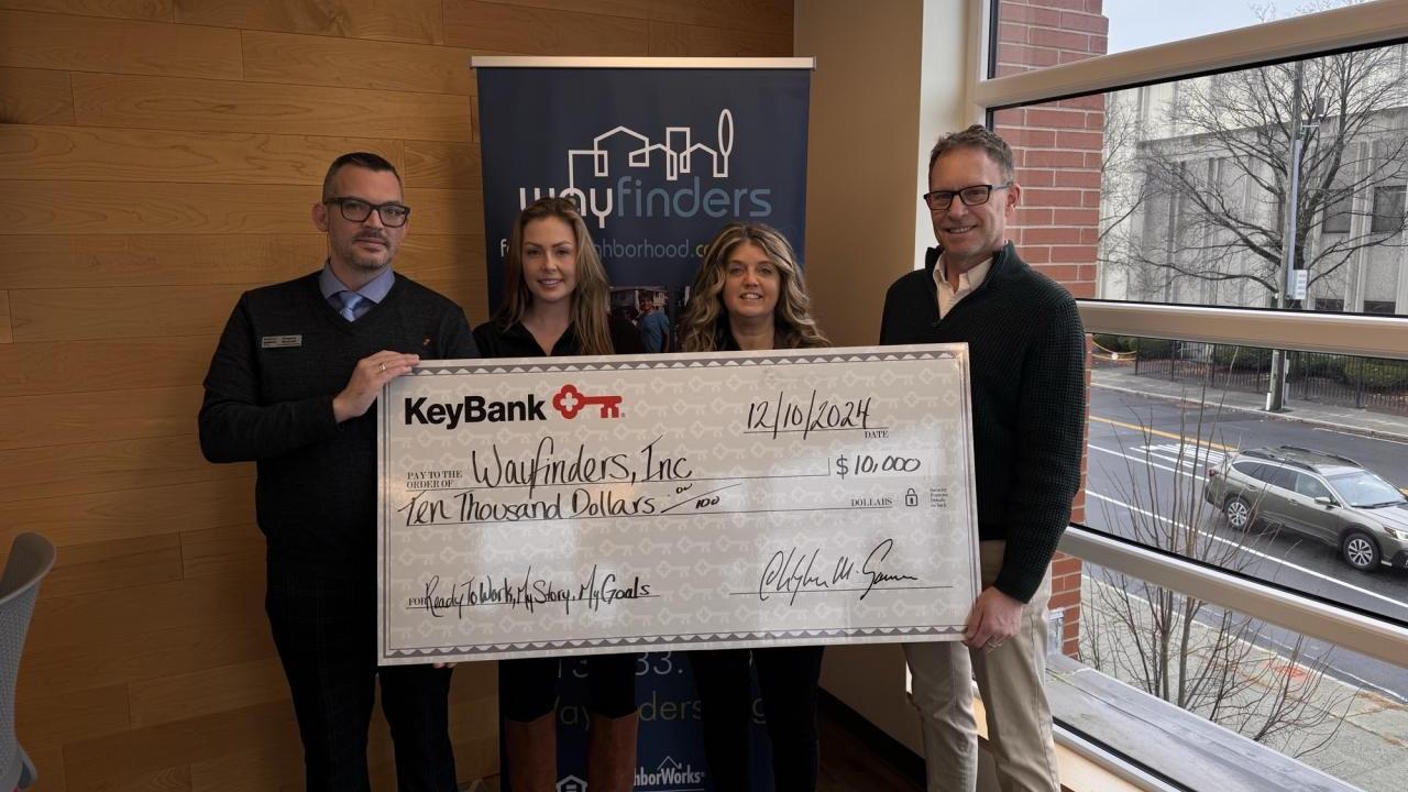 Photo caption: (from left) KeyBank leaders Greg Mularki, Branch Manager; Analisha Michanczyk, Corporate Responsibility Officer; and Tracy Menges,  Regional Community Sales Manager present a grant check to Way Finders Chief Development Officer John Bidwell.