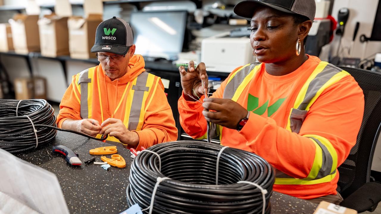 Wesco employees shown working on a production line.
