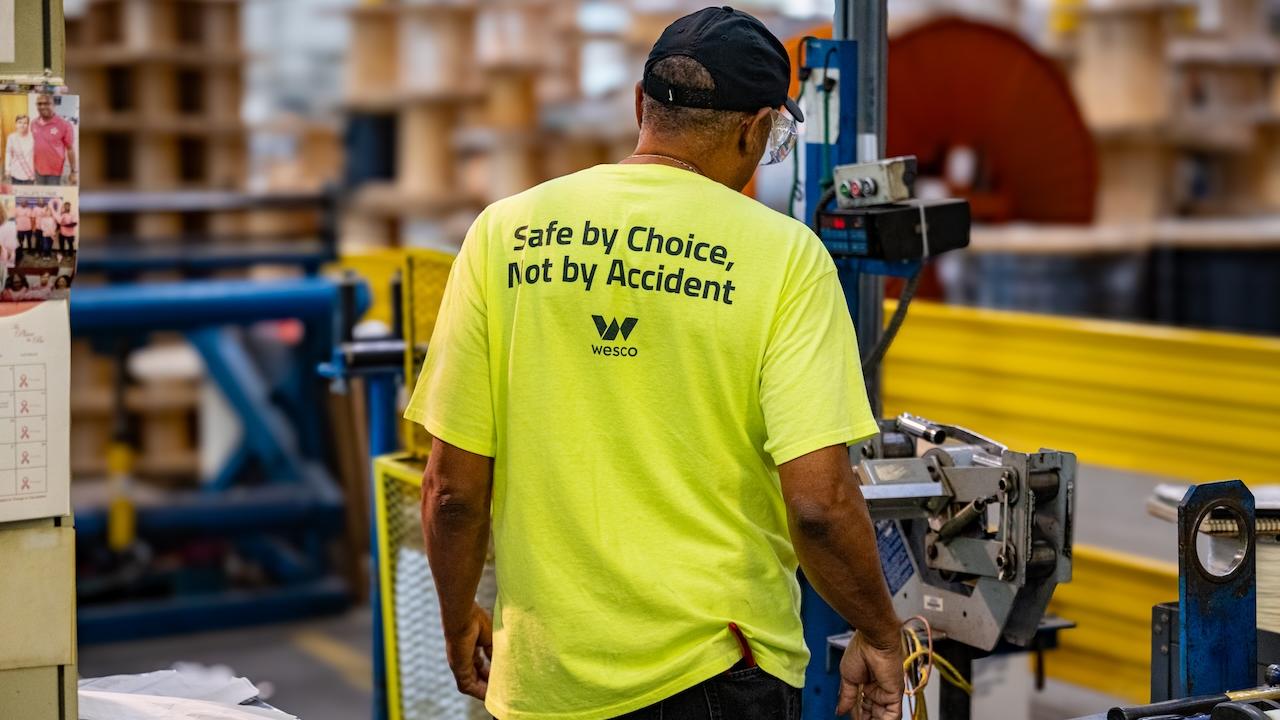 Wesco employee shown wearing a shirt that states: Safe by choice, not by accident.