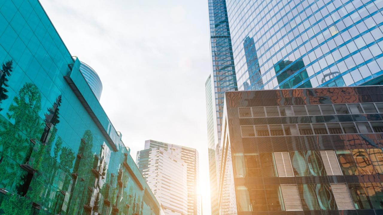 Sunlight peeking through high rise commercial buildings