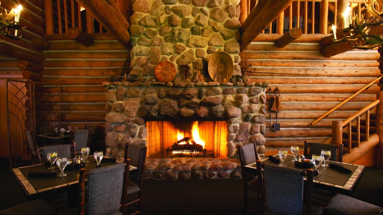 Dining tables in front of a fireplace