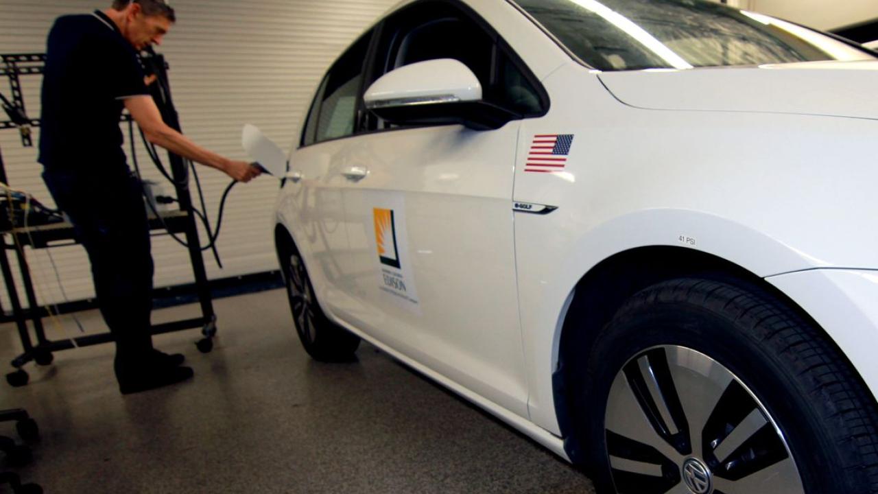 Person charging and electric car